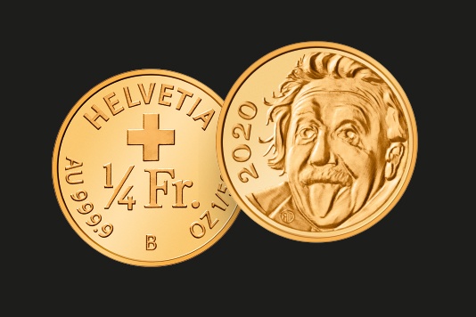 Eine kleine Goldmünze mit dem Gesicht von Albert Einstein mit rausgestreckter Zunge