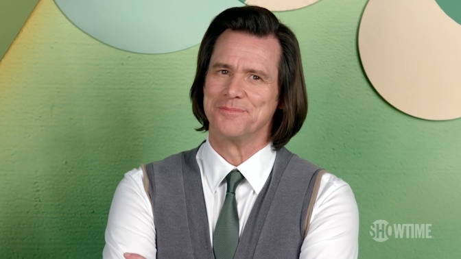 Jim Carrey  in Hemd, Pullunder und Krawatte.